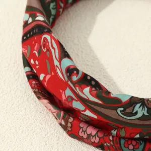 Close-up detail of vintage ethnic floral print fabric headband, showing exquisite pattern texture.