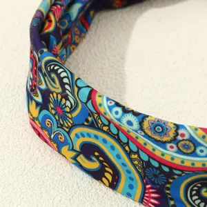 Close-up detail of the retro ethnic printed fabric headband, vibrant paisley pattern.