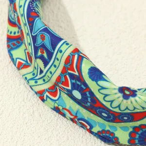 Retro ethnic style printed headband detail, colorful boho fabric hair accessory view.