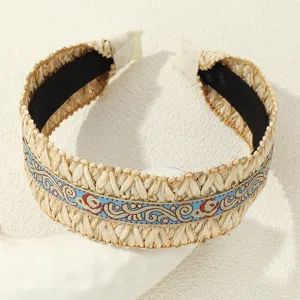 Detailed view of ethnic style straw woven wide brim headband bohemian hair accessory for women
