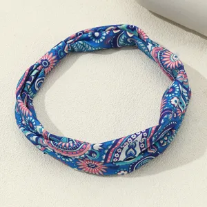 Detailed view of the blue vintage ethnic printed fabric headband, showcasing the intricate paisley.