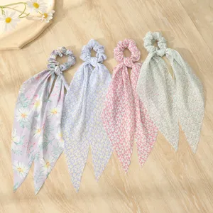 Detailed view of sweet floral long ribbon hair scrunchies, chic chiffon hair ties for women.