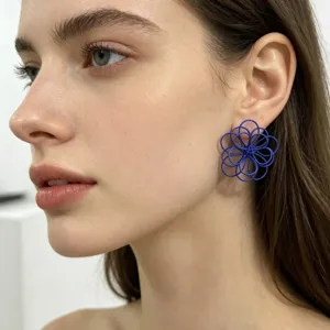 Blue openwork flower stud earrings, geometric woven design, chic vacation style jewelry.