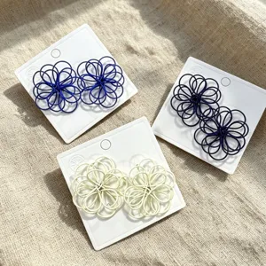 Stylish handmade hollow woven flower stud earrings in multiple colors for women daily wear.