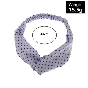 Vista dettagliata della fascia incrociata floreale viola, che mostra il tessuto elastico.