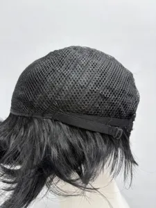 Detailed view of black wig cap with breathable mesh and adjustable strap for secure fit.