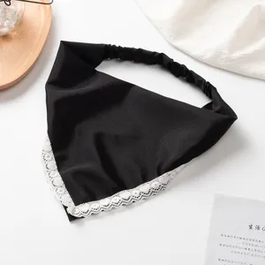 Close-up detail shot of the black triangle headscarf showcasing the elegant white lace trim.