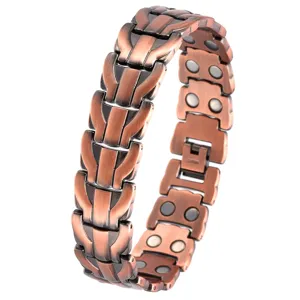 Vintage copper magnetic bracelet with detailed dragon pattern links and secure clasp design.