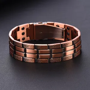Detail view of a stylish copper magnetic bracelet with textured links and secure clasp.