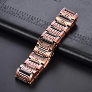 Vintage copper magnetic bracelet detail, showing intricate cross links and metallic texture.