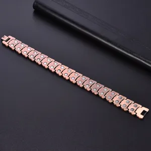 Vintage copper magnetic bracelet detail view, showcasing intricate links and metallic texture.