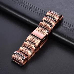 Vintage copper magnetic therapy bracelet detail showing intricate link design and cross motif.