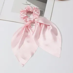 Elegant pink satin hair scrunchie with long streamers, chic French hair tie for women.