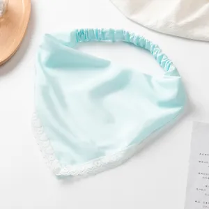 Solid color satin triangle hair scarf with delicate white lace trim and elastic band.