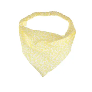 Close-up detail of the yellow floral elastic bandana hair accessory, showcasing the fresh print.