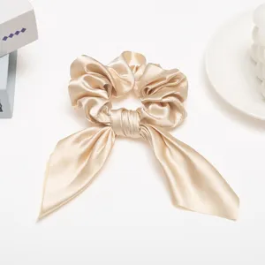 Silk satin hair scrunchie with long ribbon bow, elegant solid color hair accessory for women.