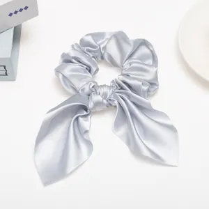 Satin ribbon hair scrunchie for women, elegant solid color bow knot hair tie accessory.