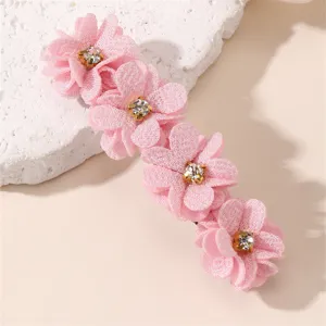Pince à cheveux fleur en tissu rose avec strass brillants, accessoire élégant pour femmes.
