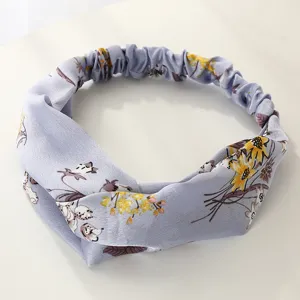 Bandeau en tissu fleuri au design noué chic, parfait pour un usage quotidien.