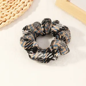 Blue plaid fabric hair scrunchie, soft fuzzy texture hair tie for ponytail styling and daily hair accessories.