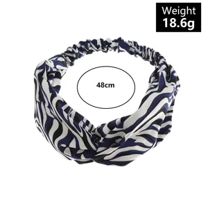 Cow print twist headband for women, elastic hair hoop, 48cm, lightweight 18.6g yoga accessory.