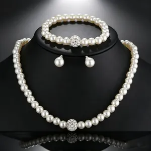 Elegant 3-piece pearl jewelry set with necklace bracelet earrings and rhinestones.