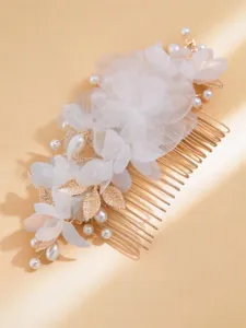 Elegant bridal hair comb featuring white chiffon flowers, pearls, and gold-toned leaves.