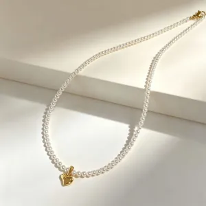 French vintage style pearl necklace with gold heart pendant elegant clavicle chain jewelry.