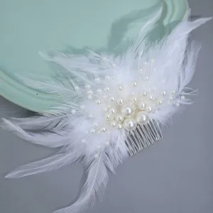 Bridal white feather and faux pearl hair comb handmade elegant wedding hair accessory detail shot