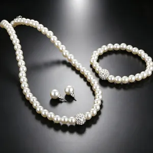 Detail view of artificial pearl jewelry set necklace bracelet earrings with crystal balls.