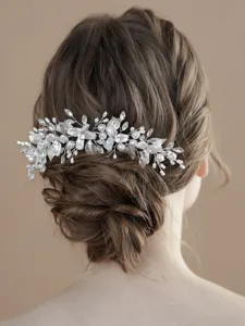 Stunning bridal hair vine detail featuring pearls and crystals, perfect for wedding updo hairstyles.
