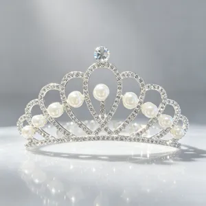 Details of the silver rhinestone crystal tiara showing sparkling gems and faux pearls closely.