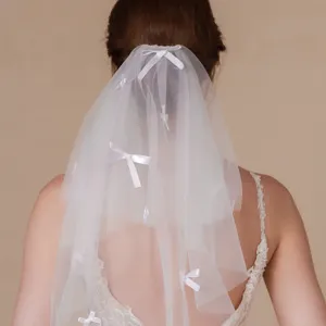 White double layer bridal veil with cute little bows, soft mesh wedding hair accessory.