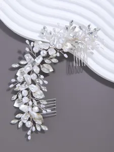 Exquisite bridal hair comb with pearls and crystals, perfect for wedding updo styling.