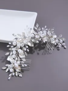 Silver bridal hair comb with pearls and crystals, elegant wedding hair accessory for women.