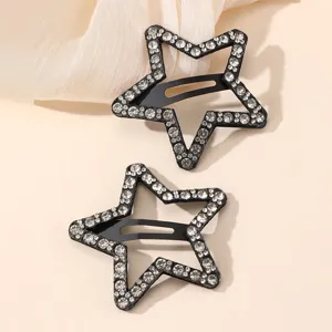 Detailed view of sparkly rhinestone star hair clips, elegant side clip design for women.