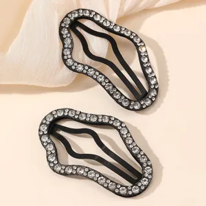 Close-up detail shot of sparkling rhinestone black hair clips, showing exquisite craftsmanship.