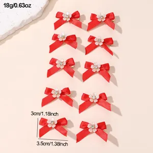 Red ribbon bow hair clips set with small floral rhinestones for women and girls daily wear.