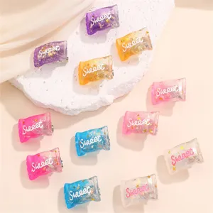 Cute candy shaped resin hair clips with glitter and cute text for women and girls daily wear.