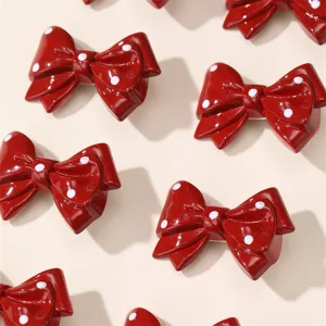 Red polka dot bow hair clips detail shot, cute sweet style resin hair accessories set for women.