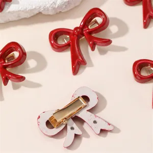 Red bow hair clip set for women, cute duckbill hair accessories, stylish and glossy.
