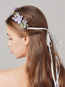 Detail view of the purple floral bridal hair vine with delicate acrylic beads and white ribbons.