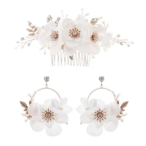 Bridal hair comb and earrings set with white fabric flowers, pearls, and rhinestones.