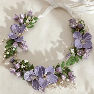 Exquisite purple flower hair vine detail, featuring acrylic blooms, pearls, and delicate gold wire.