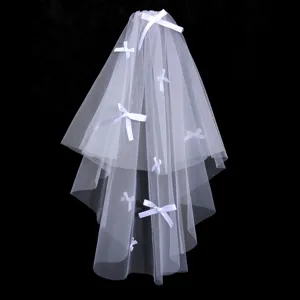 Korean style double layer white bridal veil with cute bow accents for wedding photography.