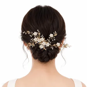Handmade bridal hair clip with ceramic flowers and pearls for wedding and special events.