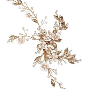 Exquisite handmade bridal hair clip featuring gold wire, white ceramic flowers, and pearls.