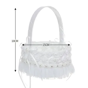 Detailed view of white wedding flower basket with lace, pearls and bow. Height 18cm width 15cm.