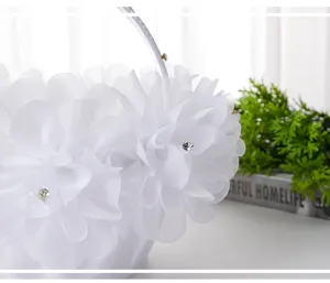 Detailed white wedding flower girl basket, sheer organza floral petals with crystal stones.