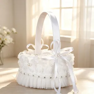 Detail view of white lace pearl bow flower basket for wedding flower girl ceremony.